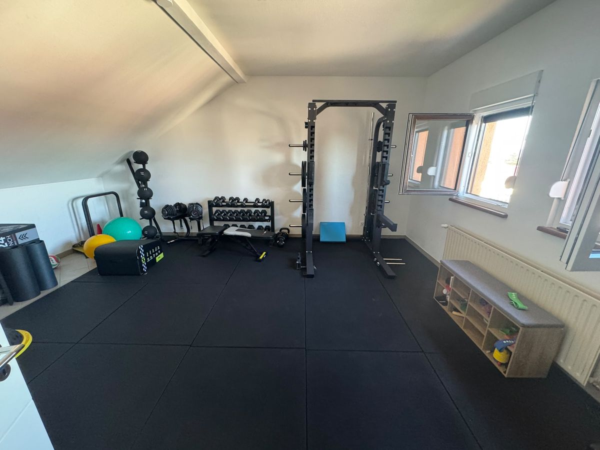 Practice training area with power rack, free weights and accessories.